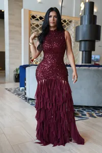 Elegant burgundy sequin sleeveless party dress with tiered mesh ruffled skirt detail