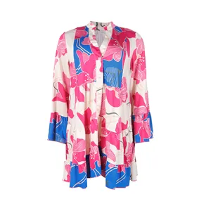 Detail of the colorful floral print and button-down front of the short dress