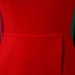 Close-up view of elegant red dress showing high waist seam and premium fabric texture