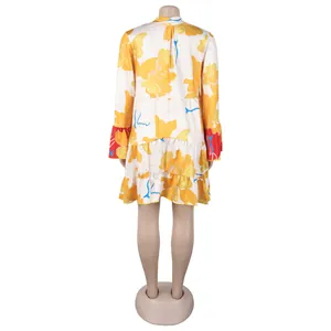 Back view of an elegant floral print loose mini dress with contrast sleeve details