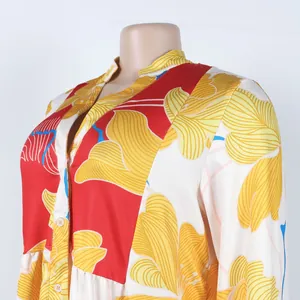 Detailed macro shot of the floral print and button-front V-neckline on a summer dress
