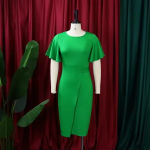 Close-up of green high-waisted dress with flutter sleeves and decorative buttons.