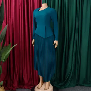 Elegant teal long-sleeve midi dress featuring a unique asymmetrical pleated skirt.