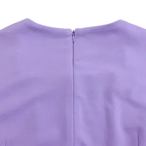 Close-up view of the concealed back zipper detail on this elegant purple flounce dress