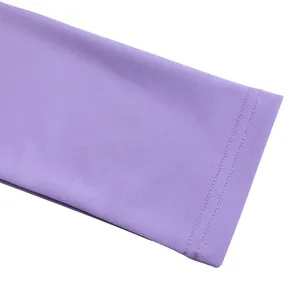 Macro detail of high-quality double-needle stitched cuff on purple long-sleeved dress