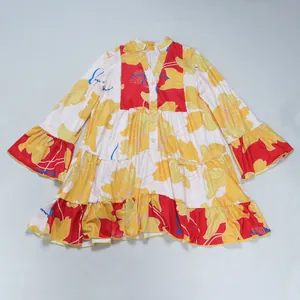 Close-up view of floral print V-neck patchwork mini dress with ruffled hem