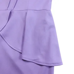 Close-up detail of elegant purple ruffle decoration on high-quality dress fabric