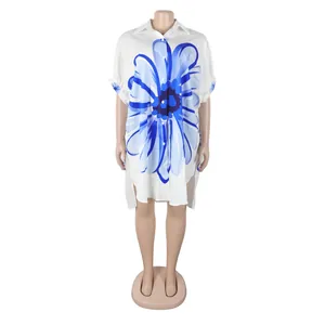 Gedetailleerd vooraanzicht van een elegant wit lang overhemd met bloemenprint op pop