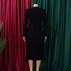 Rear view of elegant black long-sleeved midi dress featuring a stylish peplum waist detail