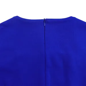 Close-up detail of royal blue dress showing hidden back zipper and fine knit texture fabric.