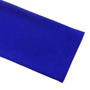 Macro close-up view showing the double stitching detail on royal blue long sleeve cuff