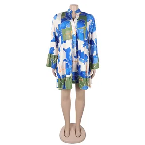 Full view of floral print loose mini dress with V-neck and ruffled tiers on a mannequin.