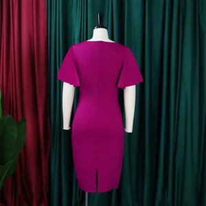 Back view of fuchsia ruffle sleeve office dress with high waist and back slit
