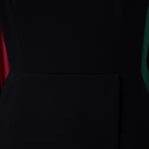 Macro view showing the fine stitching and high waist detail of this elegant black dress