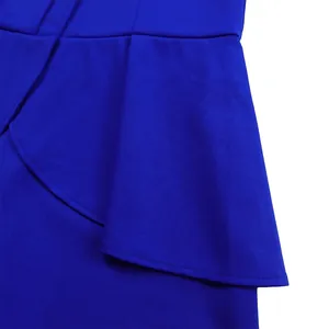 Detailed macro view of royal blue ruffle peplum and high-quality fabric on elegant women's dress