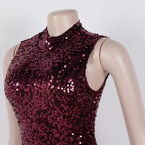 Close-up of sparkling burgundy sequin fabric and high-neck design