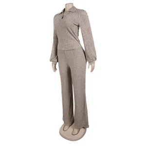 Side angle view of an elegant khaki ribbed two-piece lounge set with lantern sleeves