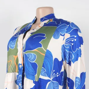 Close-up detail of the elegant blue floral print and V-neckline on a short dress