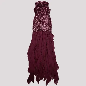 Detail view of burgundy sequined bodice and ruffled mesh skirt of an elegant evening gown