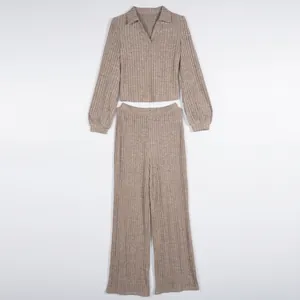 Detailed flat lay of a ribbed knit two-piece set with lantern sleeves and wide-leg pants