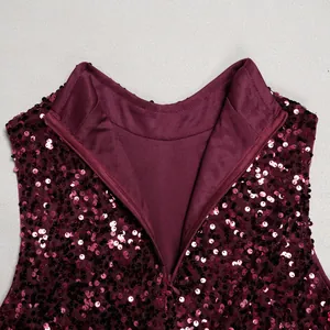 Detailed macro view of burgundy sequin dress neckline and invisible back zipper.