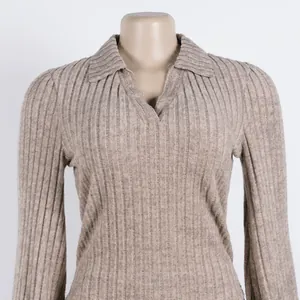 Detailed view of an elegant khaki ribbed knit polo sweater featuring a lapel collar