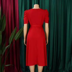 Rear view of a stylish red short-sleeved A-line midi dress with elegant puff sleeves