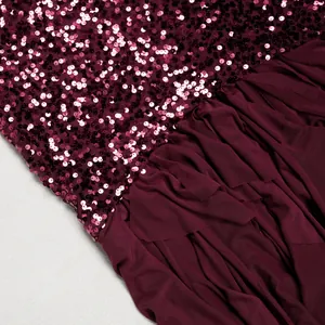 Close-up of wine red sequins and pleated mesh patchwork on elegant evening dress