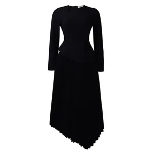 Elegant black long-sleeved midi dress with asymmetric neck cutout and pleated skirt