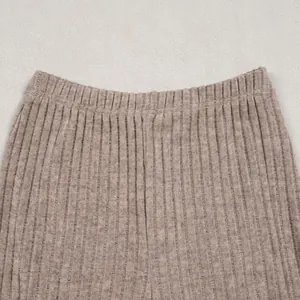 Detailed macro view of high-elastic waistband and ribbed knit texture on pants