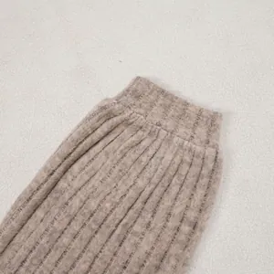 Macro view of soft ribbed knit cuff detail in beige heathered fabric for lounge set