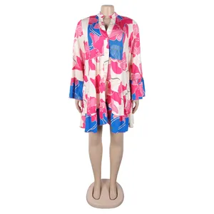 Detailed view of elegant floral print mini dress with V-neck and flared sleeves.