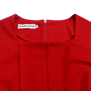 Close-up of elegant red dress square neckline with METAMORPHOSIS GIRL brand label
