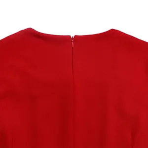 Close-up detail of the back concealed zipper on an elegant red African style dress.