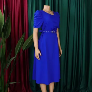 Close-up of elegant V-neck royal blue dress with pleated puff sleeves and matching belt
