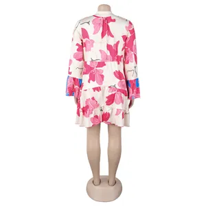 Back view of an elegant loose floral print mini dress featuring blue flared sleeves