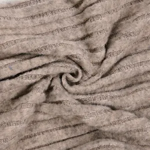 Macro detail showing the soft ribbed fuzzy knit fabric texture of the elegant set