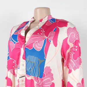 Detailed view of an elegant floral print V-neck color-block mini dress with buttons