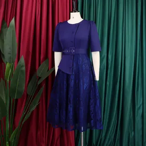 Detailed view of elegant navy blue lace patchwork dress with high waist and buckle belt