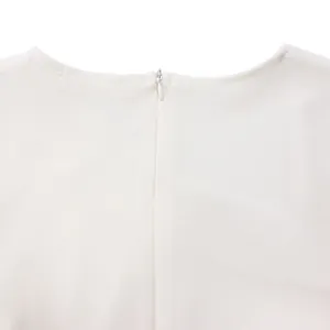 Close-up of the invisible zipper and white fabric texture on an elegant midi dress