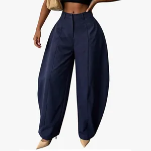Detailed view of navy blue high-waisted baggy barrel leg trousers for women