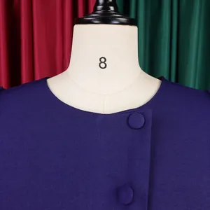 Detailed close-up view of elegant purple dress neckline with matching covered buttons