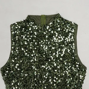 Close-up detail of olive green sequined dress with high neck and back zipper