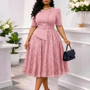 Detailed view of elegant pink lace patchwork dress featuring high waist and belt detail