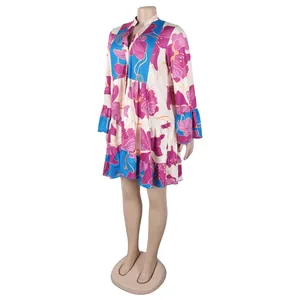 Close-up detail of an elegant loose floral print dress with V-neck and color block design.