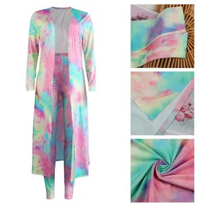 Detailed view of colorful tie-dye two-piece set showing fabric texture and seams