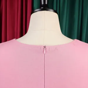 Detailed close-up of a pink summer dress back neckline with smooth invisible zipper