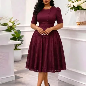 Detailed view of burgundy lace patchwork dress featuring high waist belt and side buttons