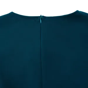 Close-up view of the high-quality invisible back zipper on a teal elegant midi dress