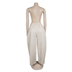 Back view of minimalist beige wide-leg casual trousers displayed on a mannequin stand